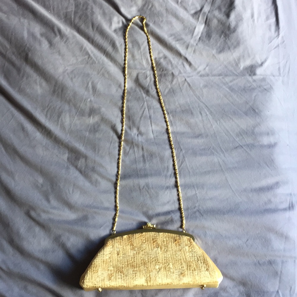 Beautiful and elegant gold clutch with chain strap